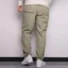 Calças casuais de homem Converse de cor sólida, tecidas e de perna reta, cinza claro Verde