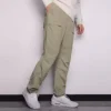 Calças casuais de homem Converse de cor sólida, tecidas e de perna reta, cinza claro Verde