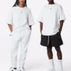 Cor sólida, corte largo, gola redonda, manga curta, estilo para casal, branco